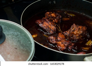 Jamaican Food Cooking In Kitchen