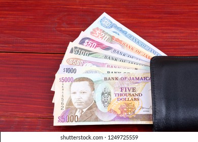 Jamaican Money In The Black Wallet 
