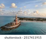 Jamaican sunset with a light house 