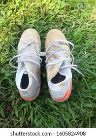 Jambi, 28th December 2019. Muddy Football Boots On The Grass