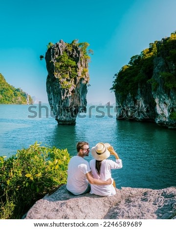 James bond Island Phangnga Bay Thailand, couple visit the Island near Phuket Thailand, men and women on a boat trip at Phangnga bay Thailand