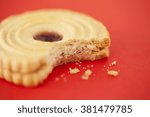 Jammy dodger biscuit/cookie on a bright red background