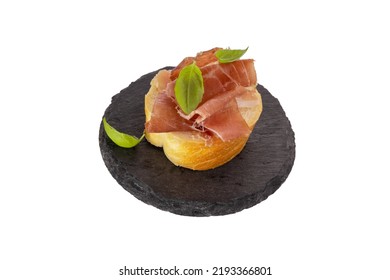 Jamon Sandwich Isolated On White Background. Spanish Meat In Thin Slices With Basil On A Piece Of White Loaf. Italian Prosciutto