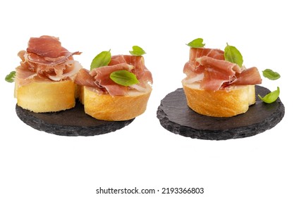 Jamon Sandwich Isolated On White Background. Spanish Meat In Thin Slices With Basil On A Piece Of White Loaf. Italian Prosciutto