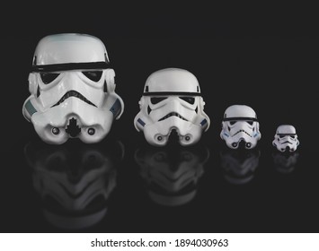 JAN 13 2021: various sized Star Wars Imperial Stormtrooper helmets - family concept - buckets - Hasbro action figures