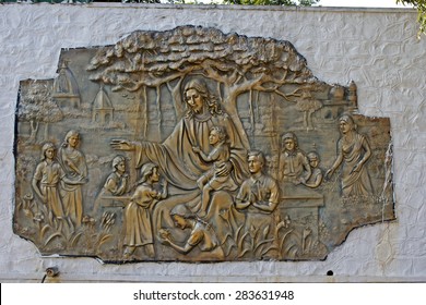 JAN 29, 2014, ST. THOMAS MOUNTAIN, CHENNAI, TAMIL NADU, INDIA - Metallic pannel with image of Jesus Christ with a children on the wall of christian school