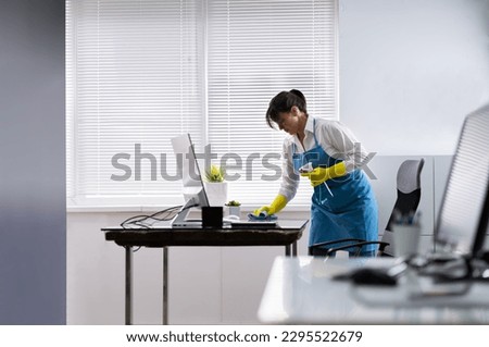 Janitor Cleaning Office Desk. Hygiene Cleaner Service Foto d'archivio © 