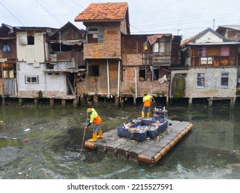 The Janitor Cleans The River. The Orange Team From The DKI Jakarta Cleaning Service Cleans The Grogol Canal.