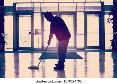 Janitor Mopping The Floor