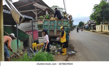 Janitor Picking Up Trash At A Temporary Shelter, In Batang, Indonesia, December 17, 2020