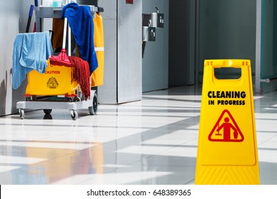 Janitorial And Mop Bucket On Cleaning In Process