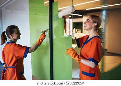 Janitorial Staff Doing The Cleaning In The Office Building