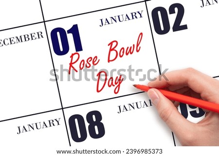 January 1. Hand writing text Rose Bowl Game on calendar date. Save the date. Holiday.  Day of the year concept.