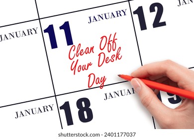 January 11. Hand writing text Clean Off Your Desk Day on calendar date. Save the date. Holiday.  Day of the year concept. - Powered by Shutterstock