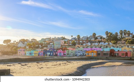 January 14, 2017 - Capitola, California: Beachgoers enjoy a sunny, cool day on the beach of Capitola know for their colorful bungalows. 