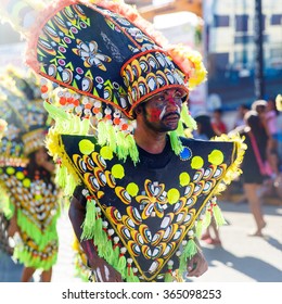 January 17th 2016. Kalibo, Philippines. Festival Ati-Atihan. Unidentified people on parade in carnival costumes. Documentary Editorial Image.