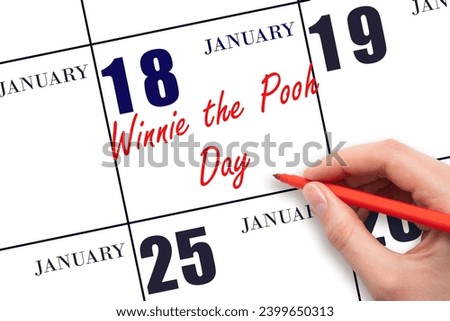 January 18. Hand writing text Winnie the Pooh Day on calendar date. Save the date. Holiday.  Day of the year concept.