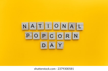 January 19, National Popcorn Day, minimalistic banner with the inscription in wooden letters - Powered by Shutterstock