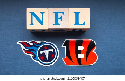 January 20, 2022. Nashville, Tennessee. The emblems of the football clubs of the playoffs of the National Football League Cincinnati Bengals and Tennessee Titans on a blue background.