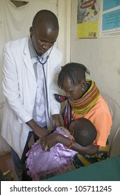 JANUARY 2007 - A Doctor Checks Mother And Children For HIV/AIDS At Pepo La Tumaini Jangwani, HIV/AIDS Community Rehabilitation Program, Orphanage & Clinic. Nairobi, Kenya, Africa