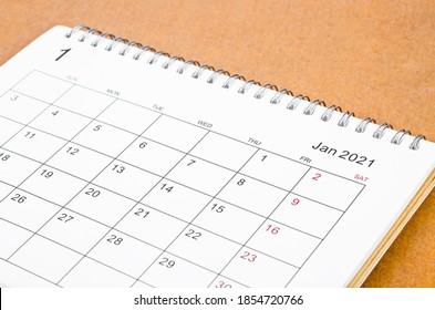 January 2021 Calendar Desk For Organizer To Plan And Reminder On Wooden Table.