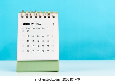 January 2022 desk calendar on blue background. - Shutterstock ID 2050104749