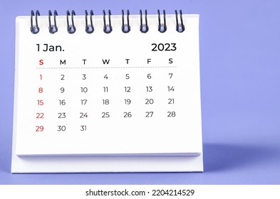 January 2023 Monthly desk calendar for 2023 year on purple background.