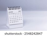 January 2025 calendar - month page on white desk