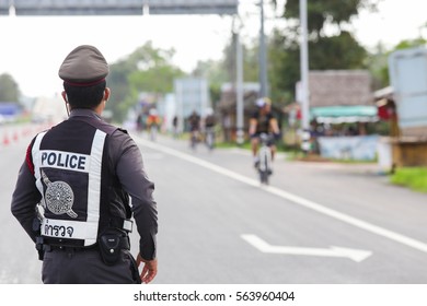 January 22th 2017,Suratthani,Thailand : The traffic police on the street at Suratthani,Road,Thailand.Police officer walking To the car