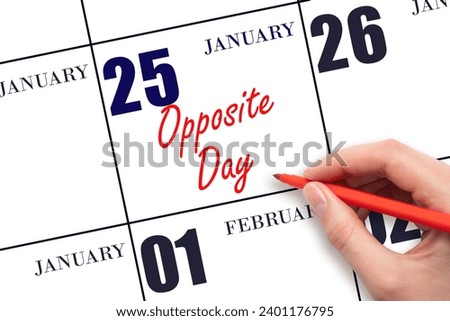 January 25. Hand writing text Opposite Day on calendar date. Save the date. Holiday.  Day of the year concept.