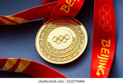 January 27, 2022, Beijing, China. XXIV Olympic Winter Games Gold Medal On A Dark Blue Background.