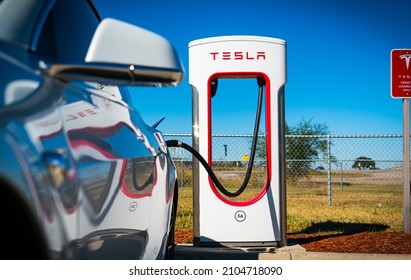 January 2nd , 2022 - San Antonio , Texas , USA: Tesla Model 3 Supercharging On Road Trip Down To Corpus Christi , Texas The New Electric Car That Is Leading The Charge