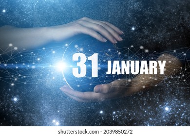 January 31st . Day 31 of month, Calendar date. Human holding in hands earth globe planet with calendar day. Elements of this image furnished by NASA. Winter month, day of the year concept
