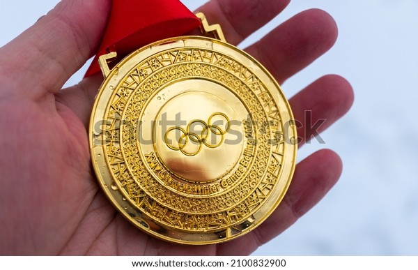 January 4, 2022, Beijing,\
China. Gold medal of the XXIV Olympic Winter Games in the palm of\
your hand.