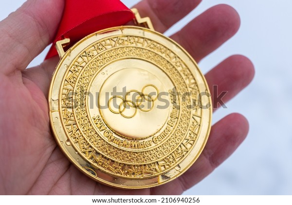 January 4, 2022, Beijing,
China. Gold medal of the XXIV Olympic Winter Games in the palm of
your hand.