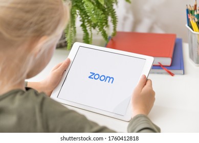 January 5, 2020, Kaliningrad, Russia. A Little Girl Using Zoom Mobile App To Join A Meeting From Her IPad. IPad Showing Zoom Cloud Meetings App Logo. Online Remote Learning.