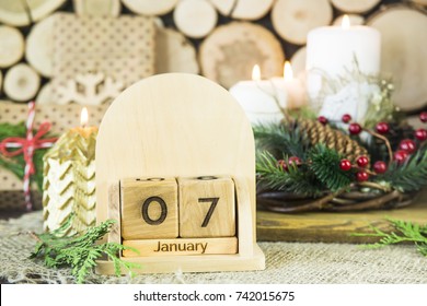 January 7 - the date of Orthodox Christmas on a wooden calendar among gifts and  decorating