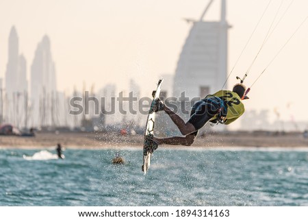 January 8th 2021, Dubai UAE,  a kitesurfer while participating in the free style competition of Kite surf open in Kite Beach with Burj Al Arab as a backdrop, Dubai