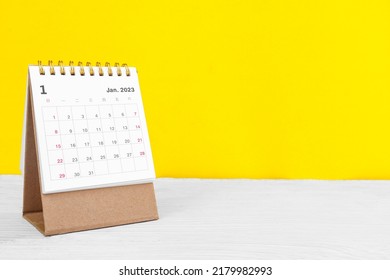 January calendar 2023 on the wooden table on a yellow background concept new year 2023