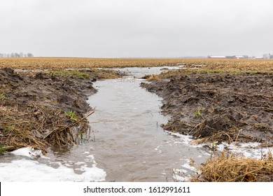 January Storms With Heavy Rain Caused Flash Flooding In Illinois Farm Fields, Overflowing Ditches And Soil Erosion From Flowing Water Runoff