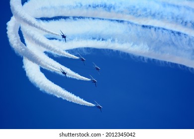 Japan Air Self-Defense Force aerobatic team Blue Impulse performing in deep blue sky