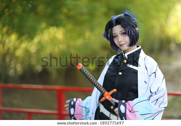 Japan anime cosplay portrait of girl with comic\
costume with japanese\
theme