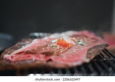 Japan Beef Grilled On Oba Leaves In Stove. Close Up