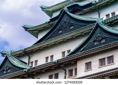 Japan Castle In Nagoya. Summer Day. Famous Japanese Castle With A Green Roof.