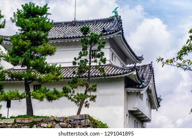 Japan Castle In Nagoya. Summer Day. Famous Japanese Castle With A Green Roof.