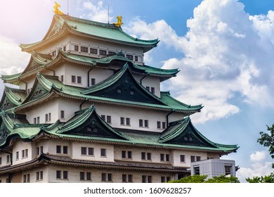 Japan Castle In Nagoya. Summer Day. Famous Japanese Castle With A Green Roof.