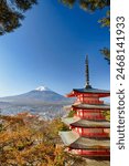 Japan Destinations. Renowned Kiyomizu-dera Temple Pagoda Against Kyoto Skyline with Traditional Red Maple Trees Against Fuji Mountain in Japan. Vertical Orientation
