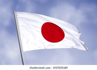 Japan flag isolated on sky background. close up waving flag of Japan. flag symbols of Japan.