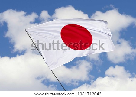 Japan flag isolated on sky background with clipping path. close up waving flag of Japan. flag symbols of Japan.