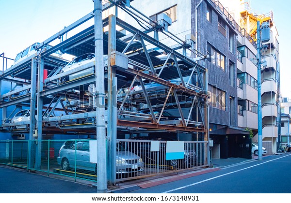 Japan.\
Tokyo. Cars in a multi-level auto parking in Japan. Automated\
parking station in Tokyo. Multi-storey outdoor parking place. Cars\
in a japanese city. Modern technology in\
Japan.